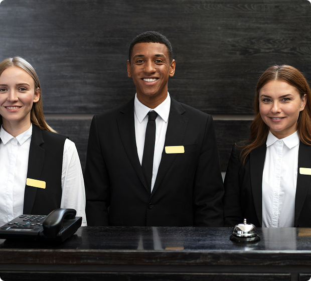 Hospitality staff at a reception desk